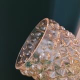 Moulded glass lamp with a cubic-spherical relief design.