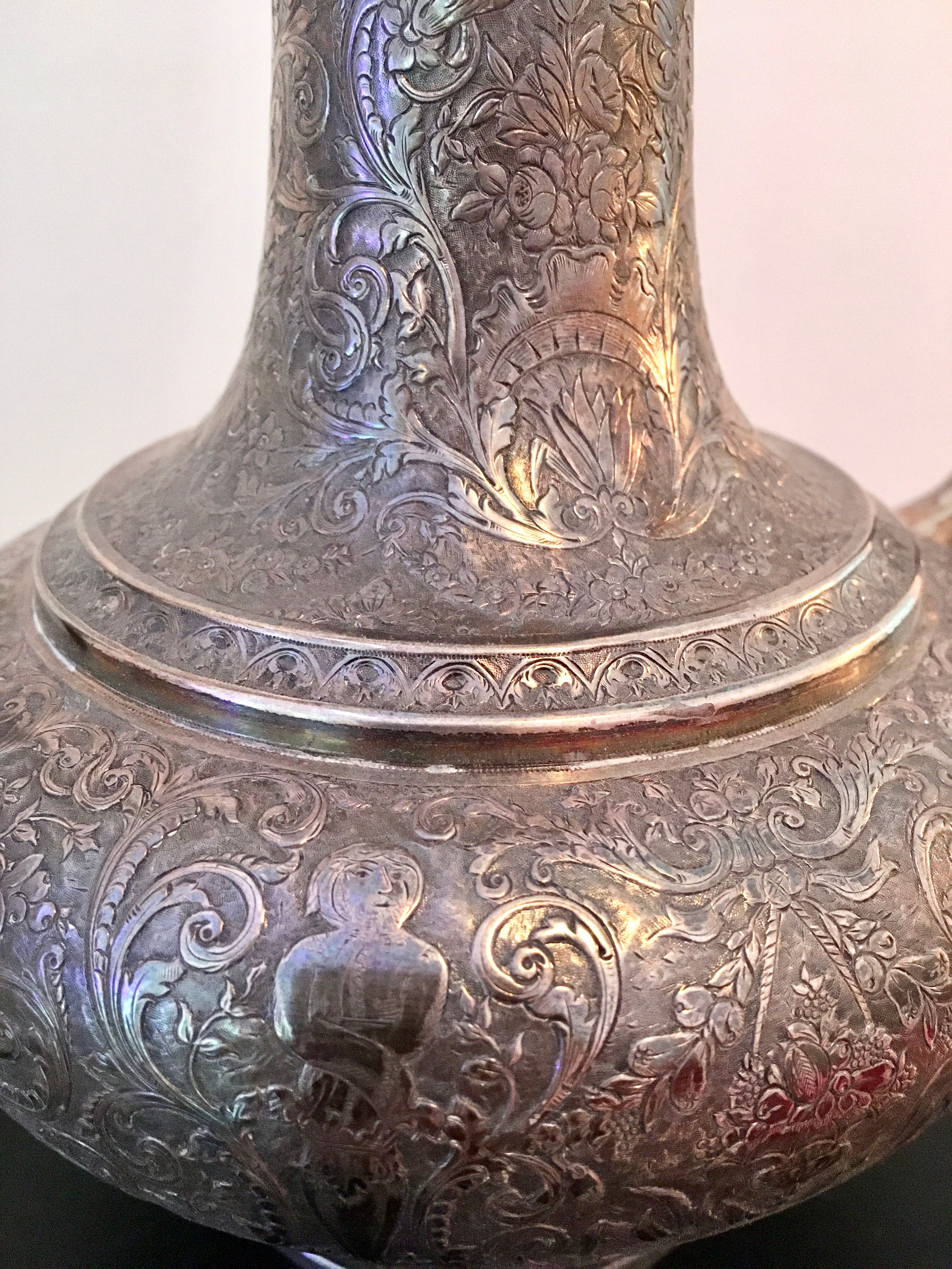 Oriental teapot made of crafted silver metal