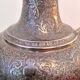 Oriental teapot made of crafted silver metal