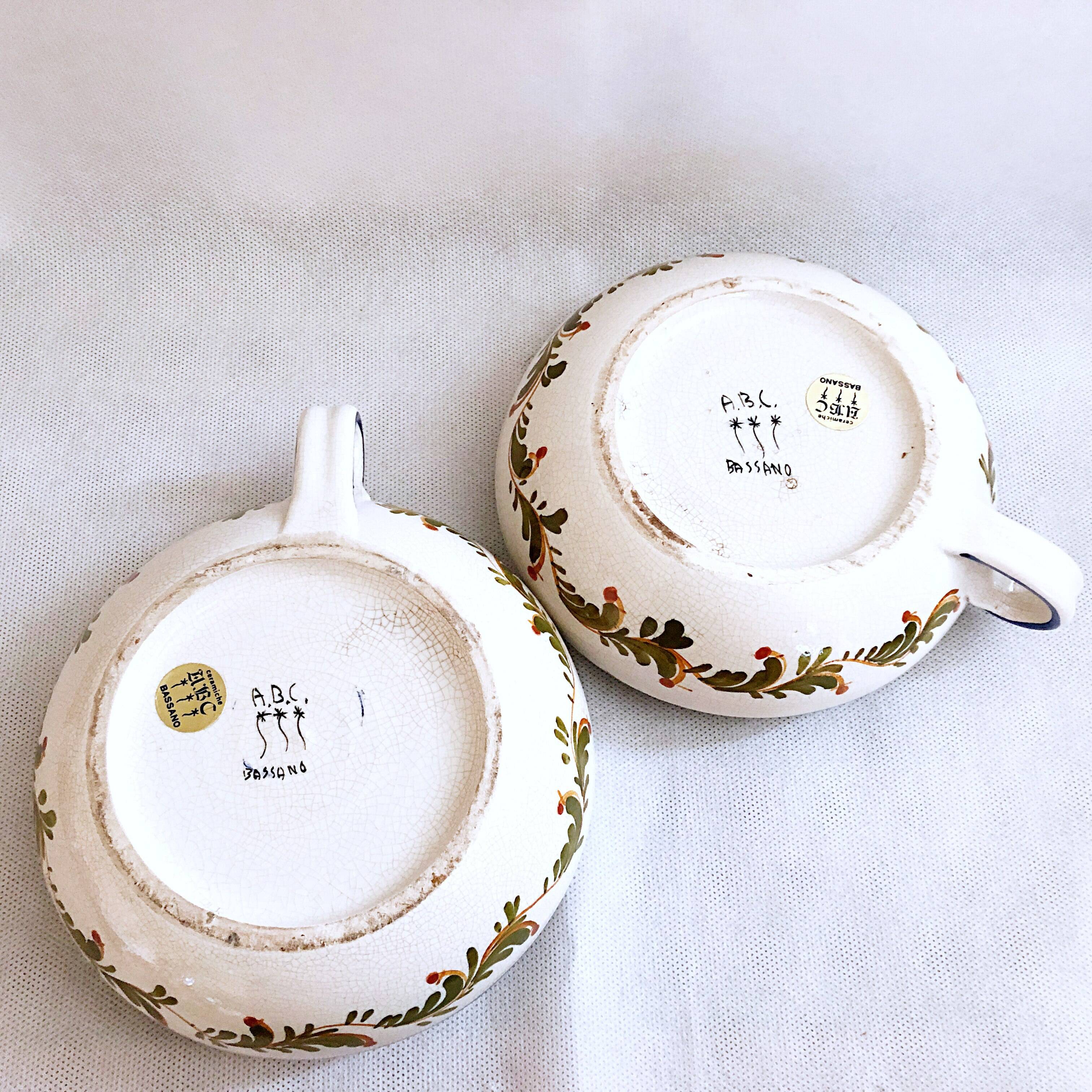 Pair of handmade cracked earthenware hand candlesticks signed Bassano Italy