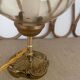 2 bedside lamps with round amber glass globes and gold metal.