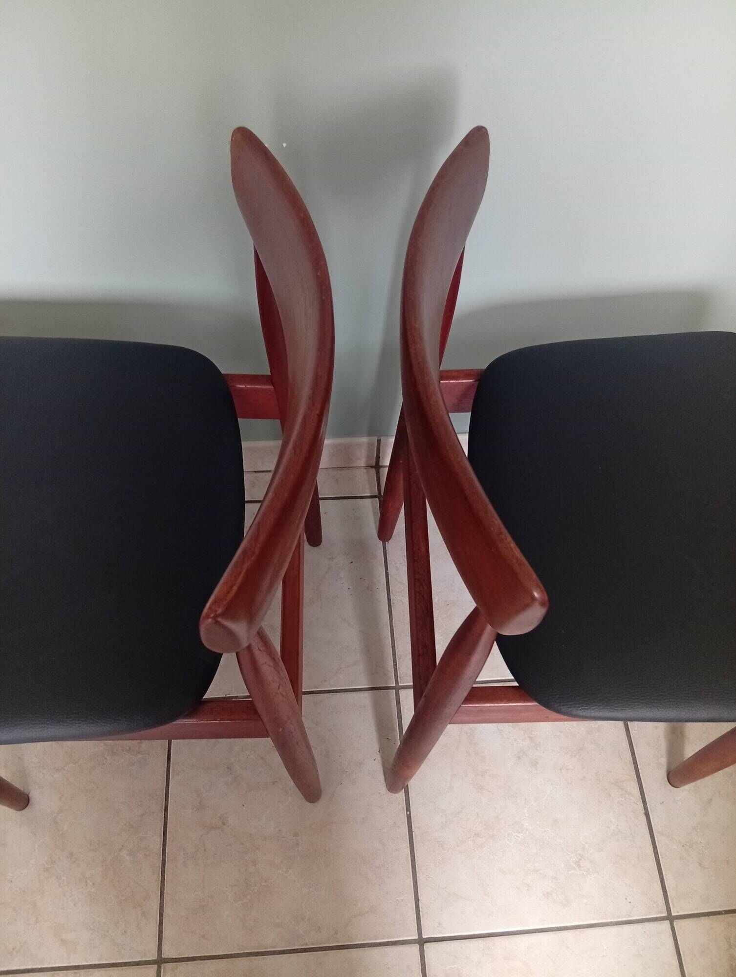 Four Danish mid-century teak armchairs.