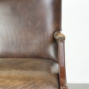 Wooden cow leather English Gainsborough chair with a stunning appearance