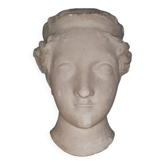 Antique plaster face of a woman