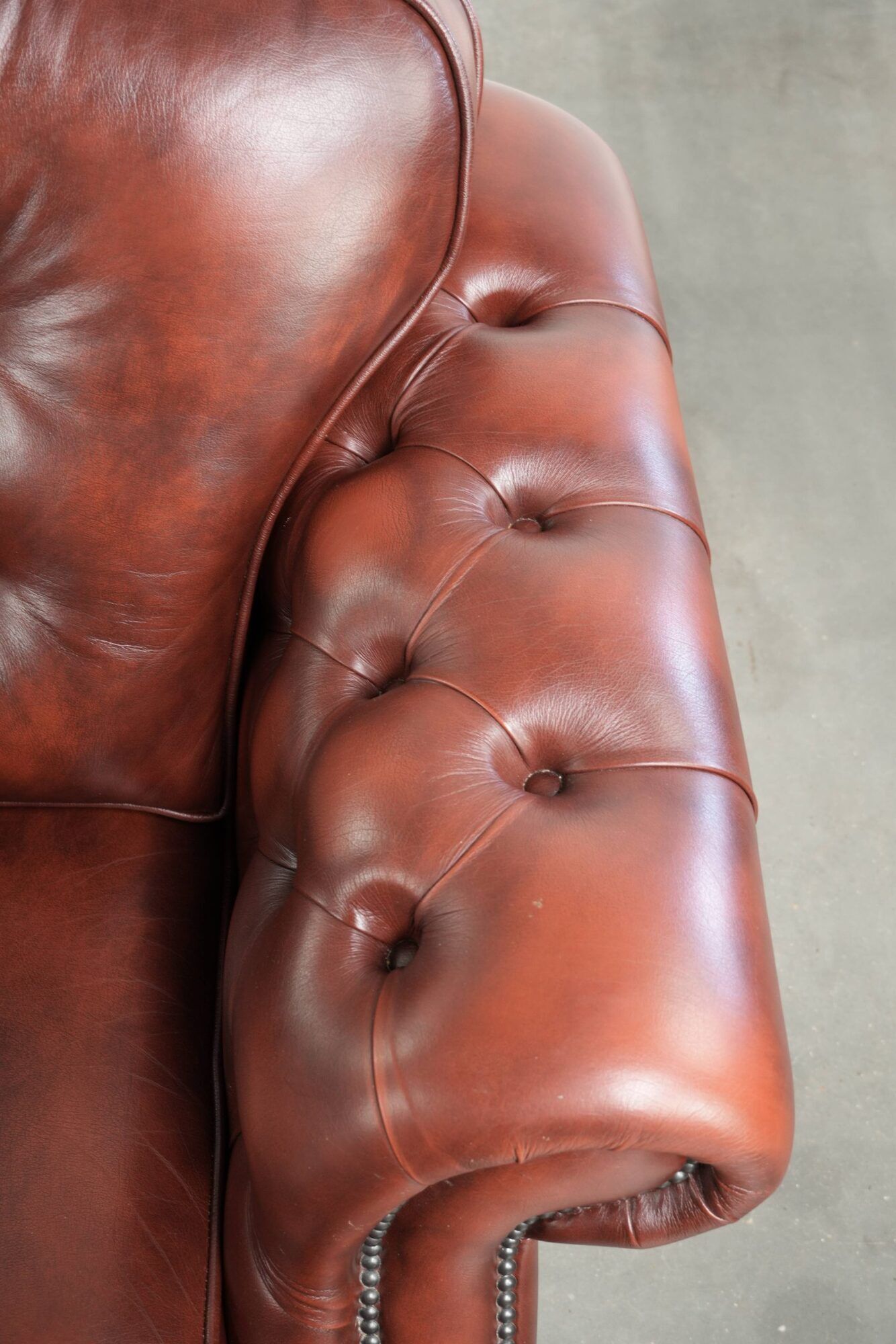 Brown cow leather Chesterfield armchair in a unique design