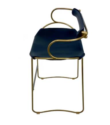 Contemporary kitchen bar stool with brass metal backrest and navy blue leather.
