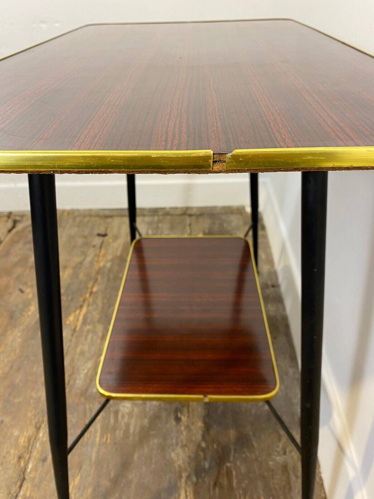 Vintage side table, brass gallery and wheels, 1950s.