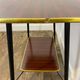 Vintage side table, brass gallery and wheels, 1950s.