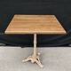 Bistro table with cast iron base and solid teak top