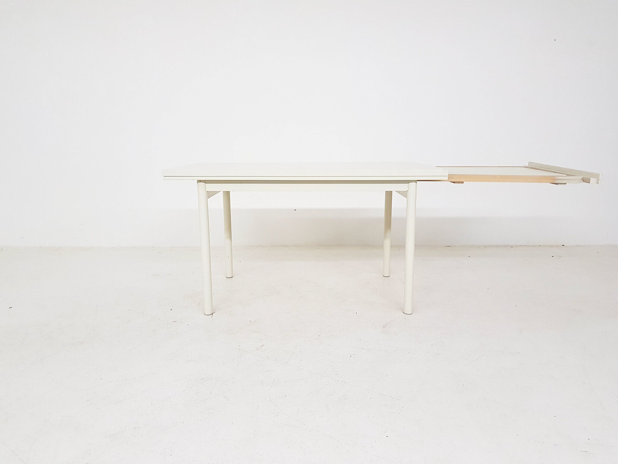 Beige extendable wooden table