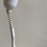 Suspension of the 80s in perforated white metal