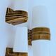 3 ochre porcelain wall sconces from the 1960s (models 6065 and 6080) by Sigvard Bernadotte for Ifö.
