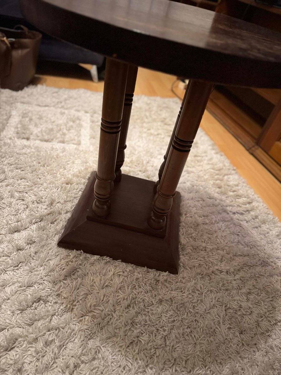 1930s Art Deco round side table in brown wood — circular top and turned legs.