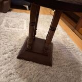 1930s Art Deco round side table in brown wood — circular top and turned legs.