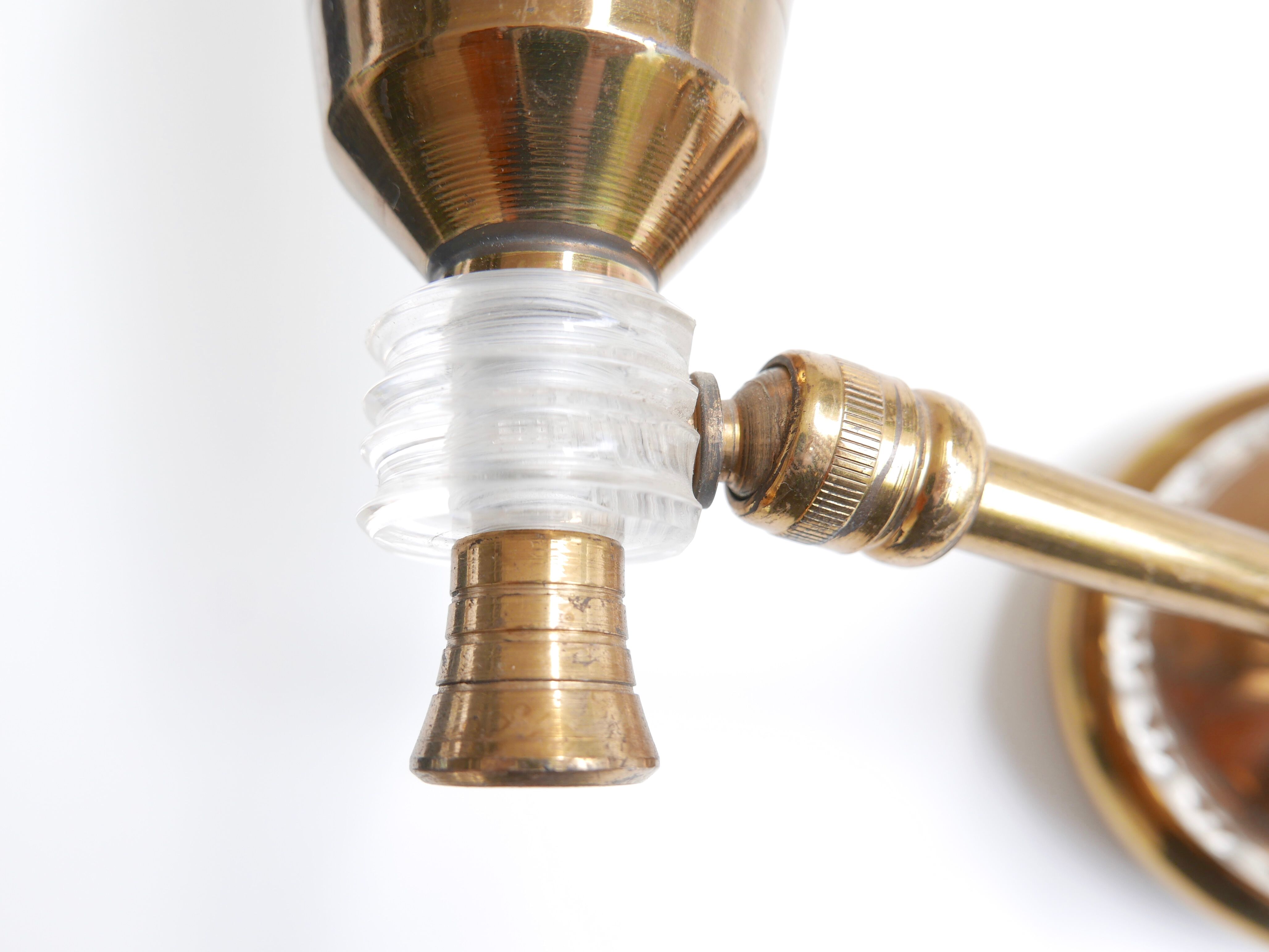 Pair of wall sconces in gold metal and plexiglass, 50 years