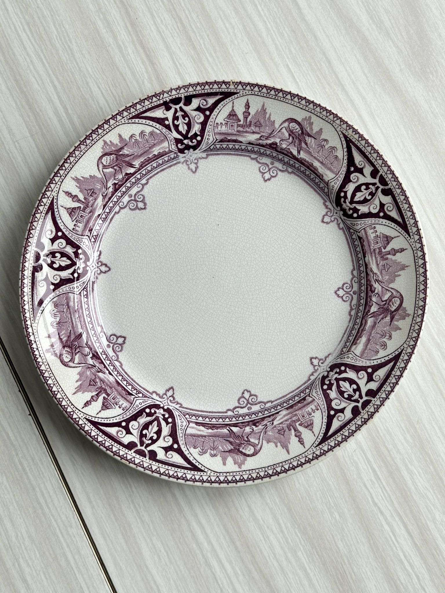 Antique plate with purple oriental decoration