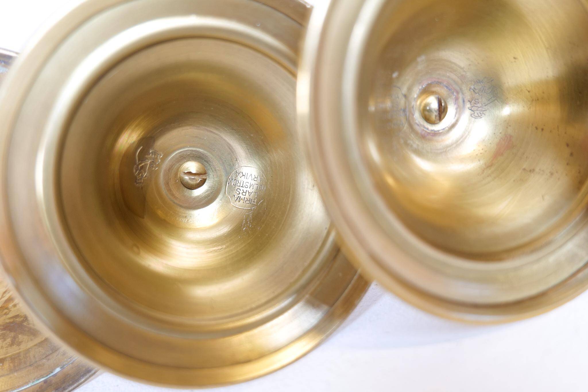 Mid-century set of 5 brass candlesticks by Lars Holmström, Arvika, Sweden.