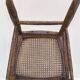 Chair with a slatted backrest and caned seat.