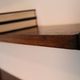 Shelves in rosewood and black lacquered metal from the 50s