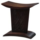 Sculptural African stool in hardwood, curved seat and architectural base, 1970s.