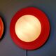 Pair of XXL Space Age wall sconces, orange lacquered metal and opaline, 1960.