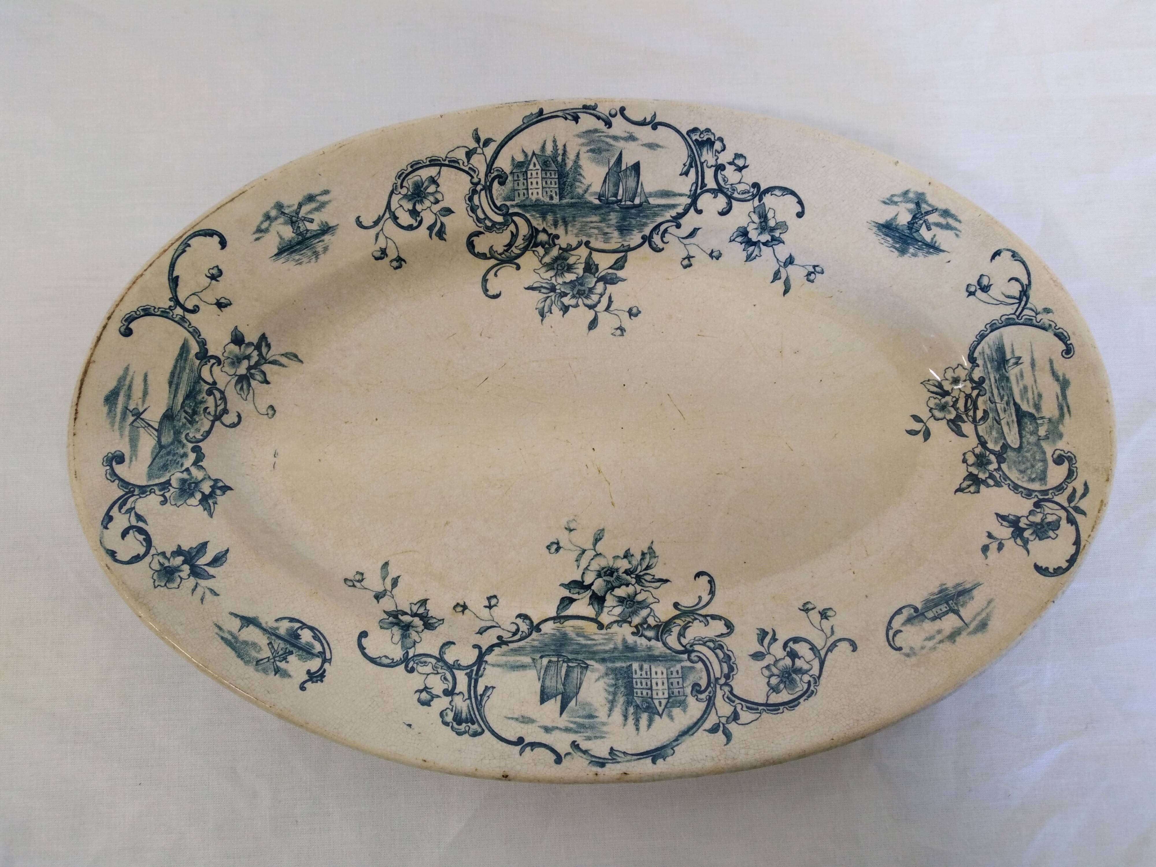 Old serving dish floral and maritime decoration