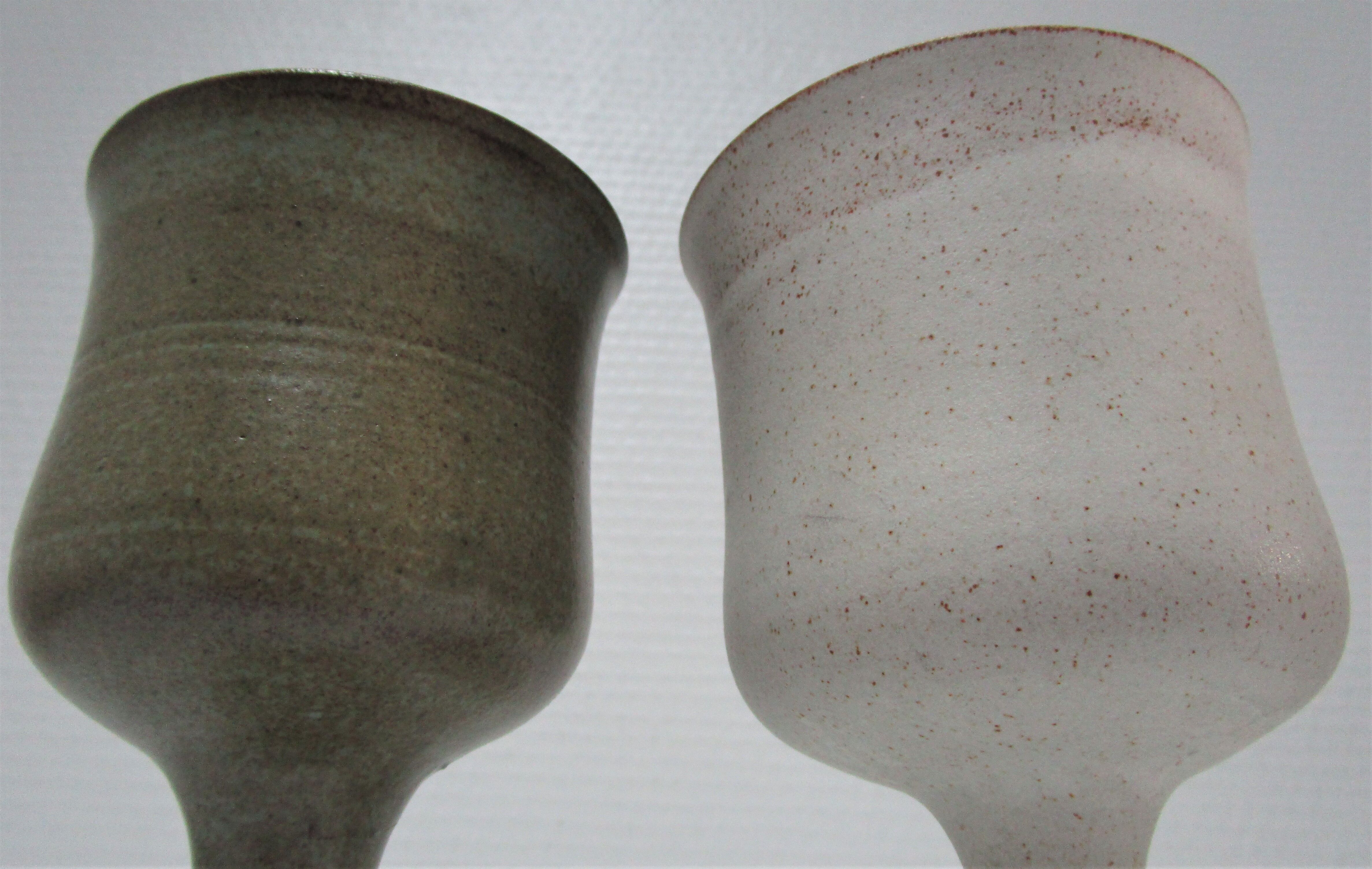 Two enamelled ceramic walking glasses