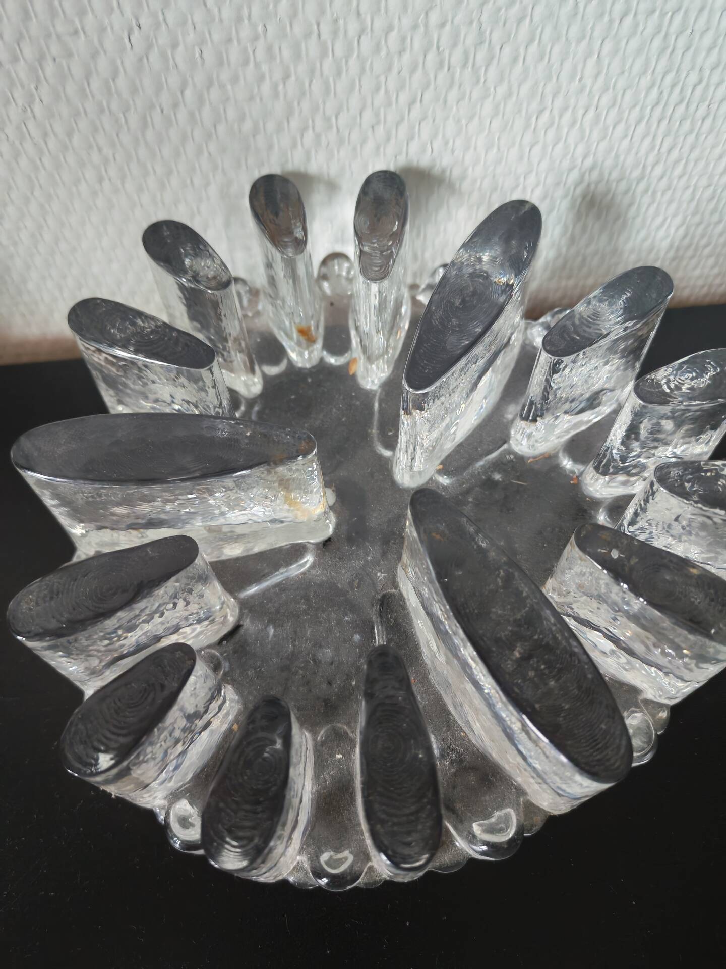 Large glass candle holder in iceberg brutalist style.