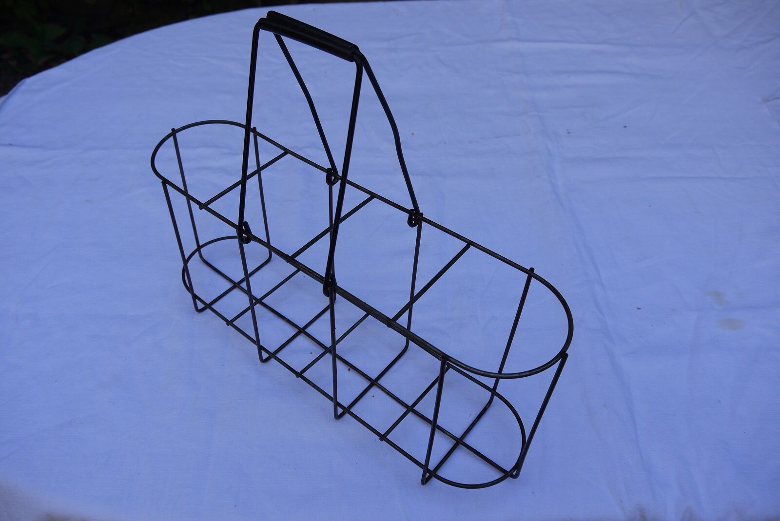 Old wire basket for 4 bottles