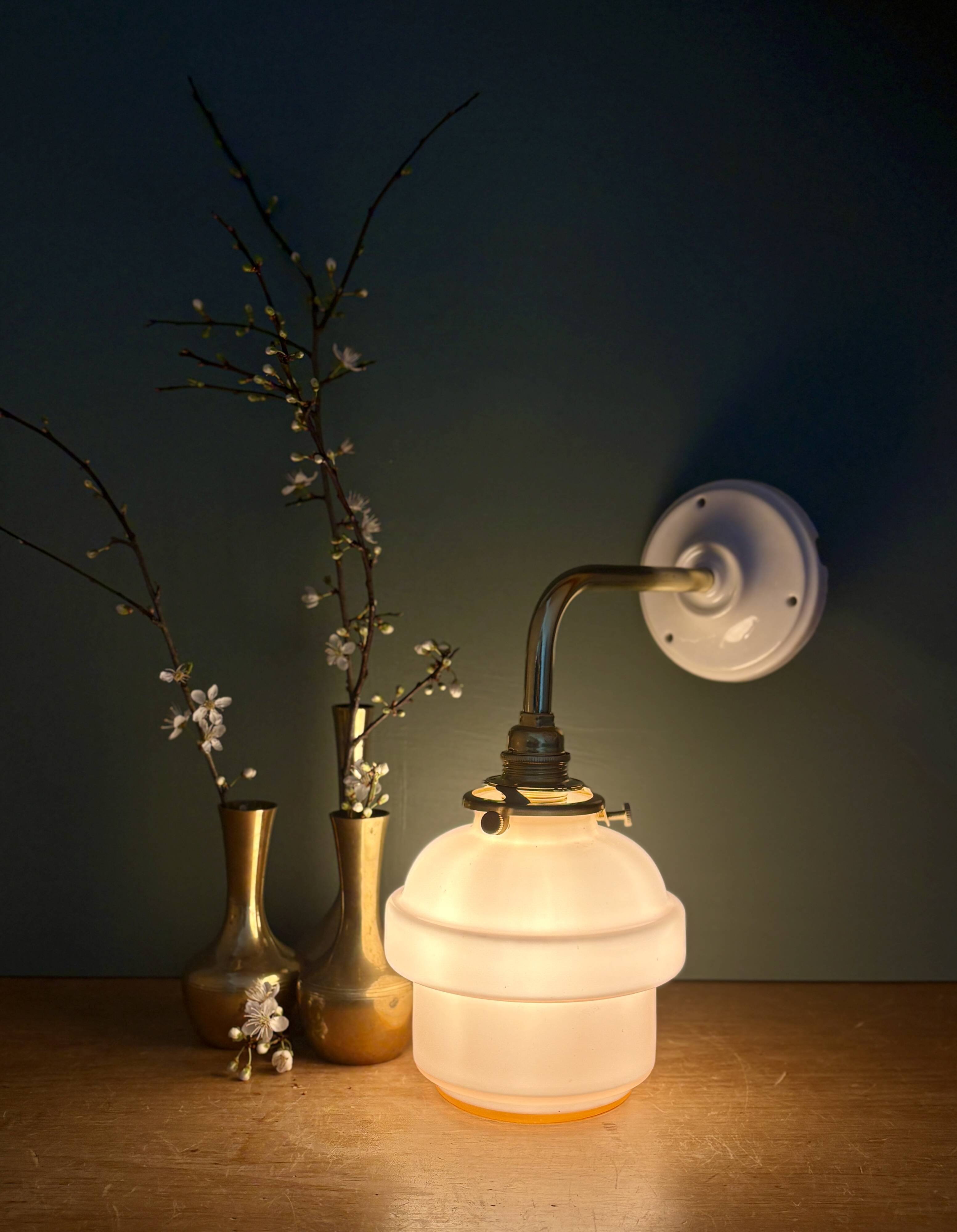 Vintage pink opaline globe wall light.