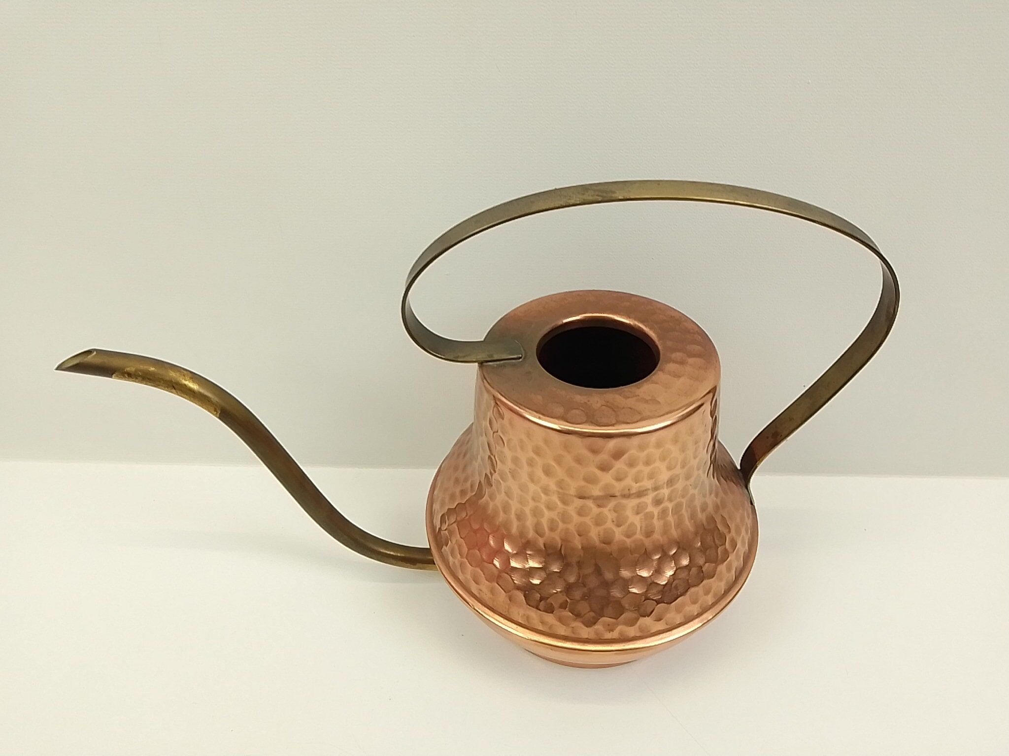 Copper and brass watering can