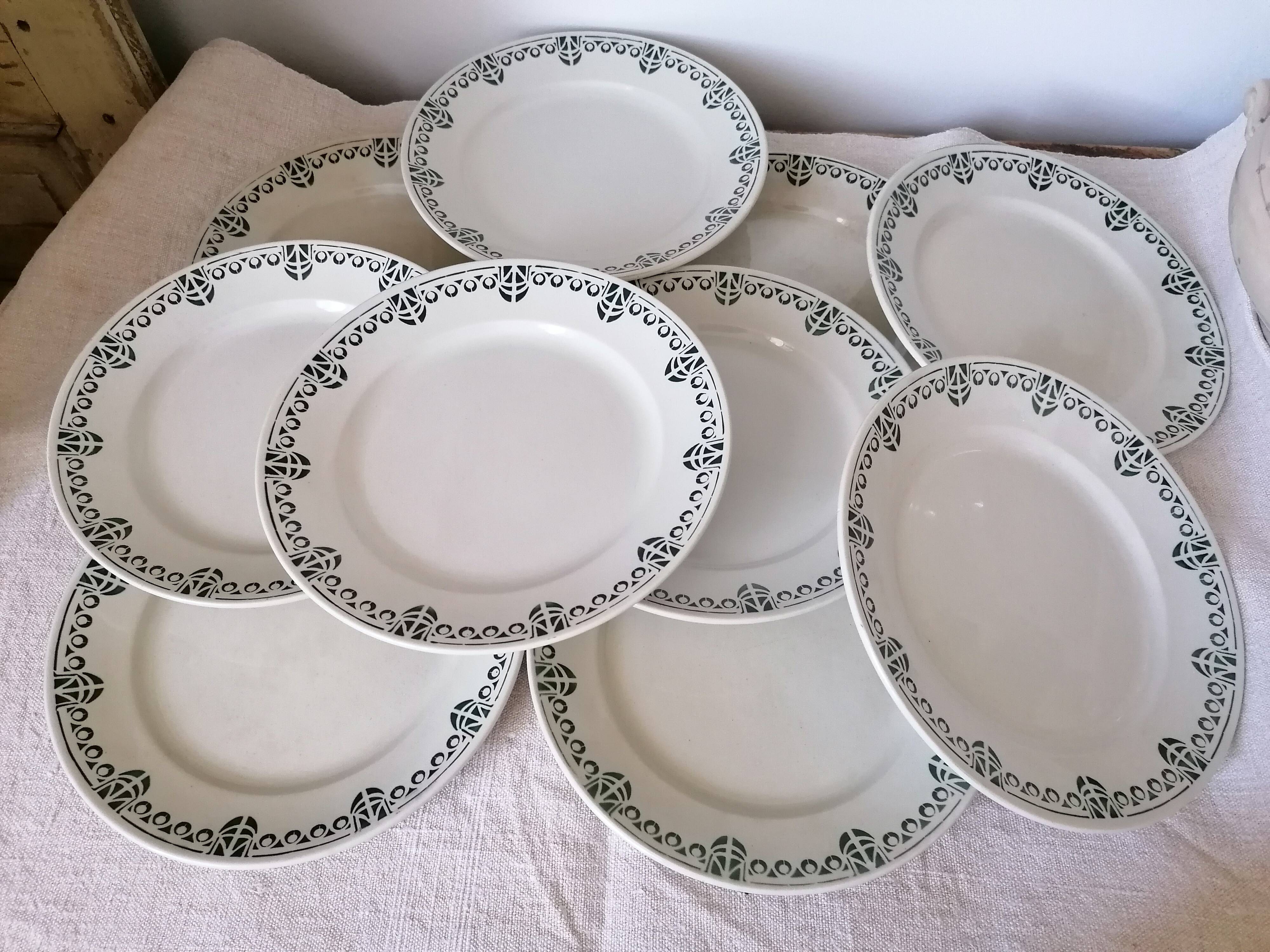 Set of 11 flat earthenware plates