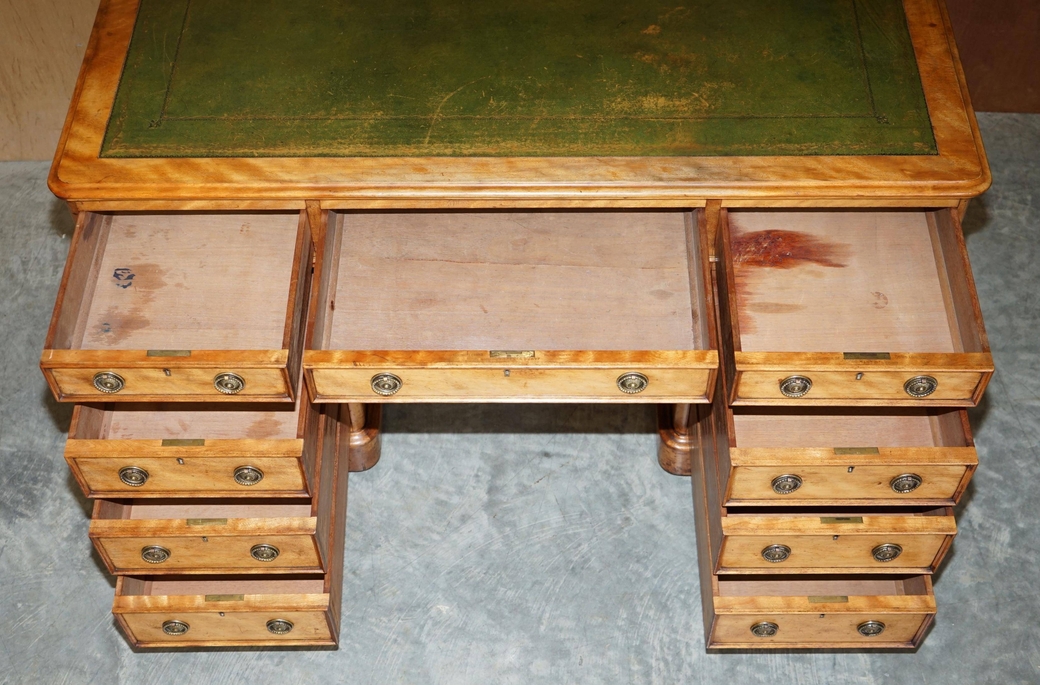 Antique desk by James Winter & Sons London in satin wood and leather.