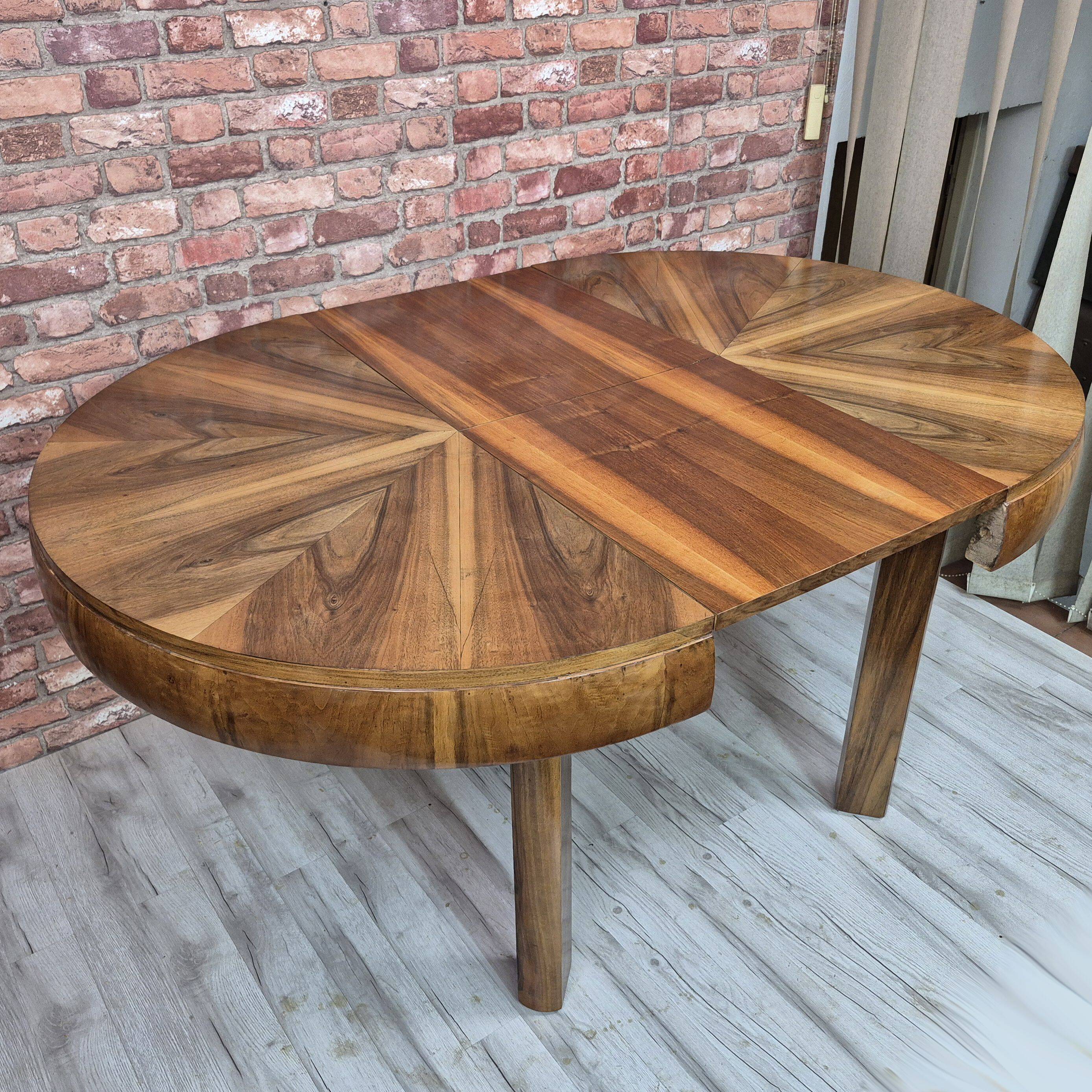Walnut extendable round table after professional restoration. Art deco.
