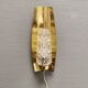 Older wall lamp in brass with hard pressed glass shade.