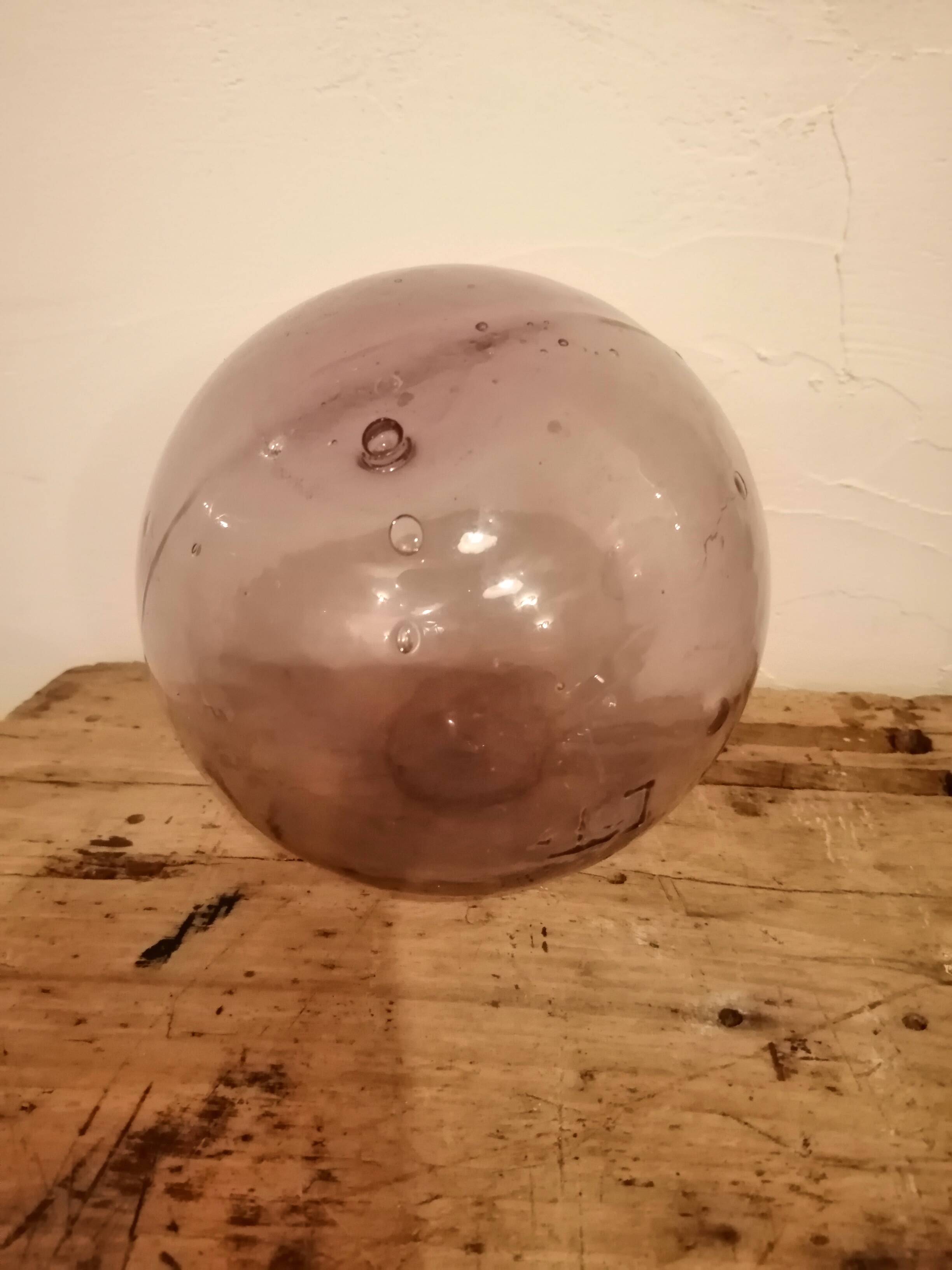 Old glass ball of fishing net marked "LT"