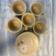 Set of 5 St Amand Autumn porcelain cups and saucers.