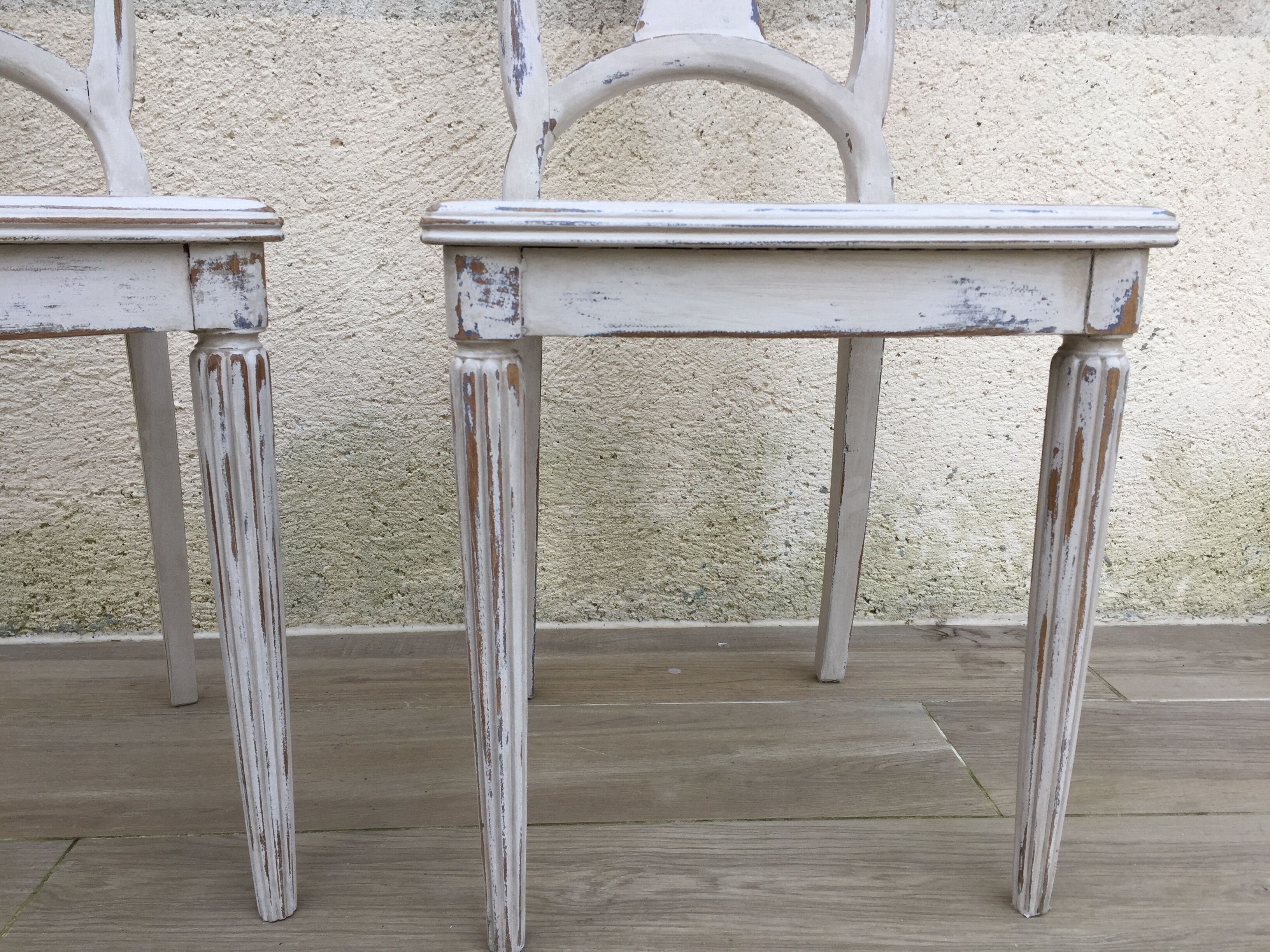 Pair of old white canne chairs