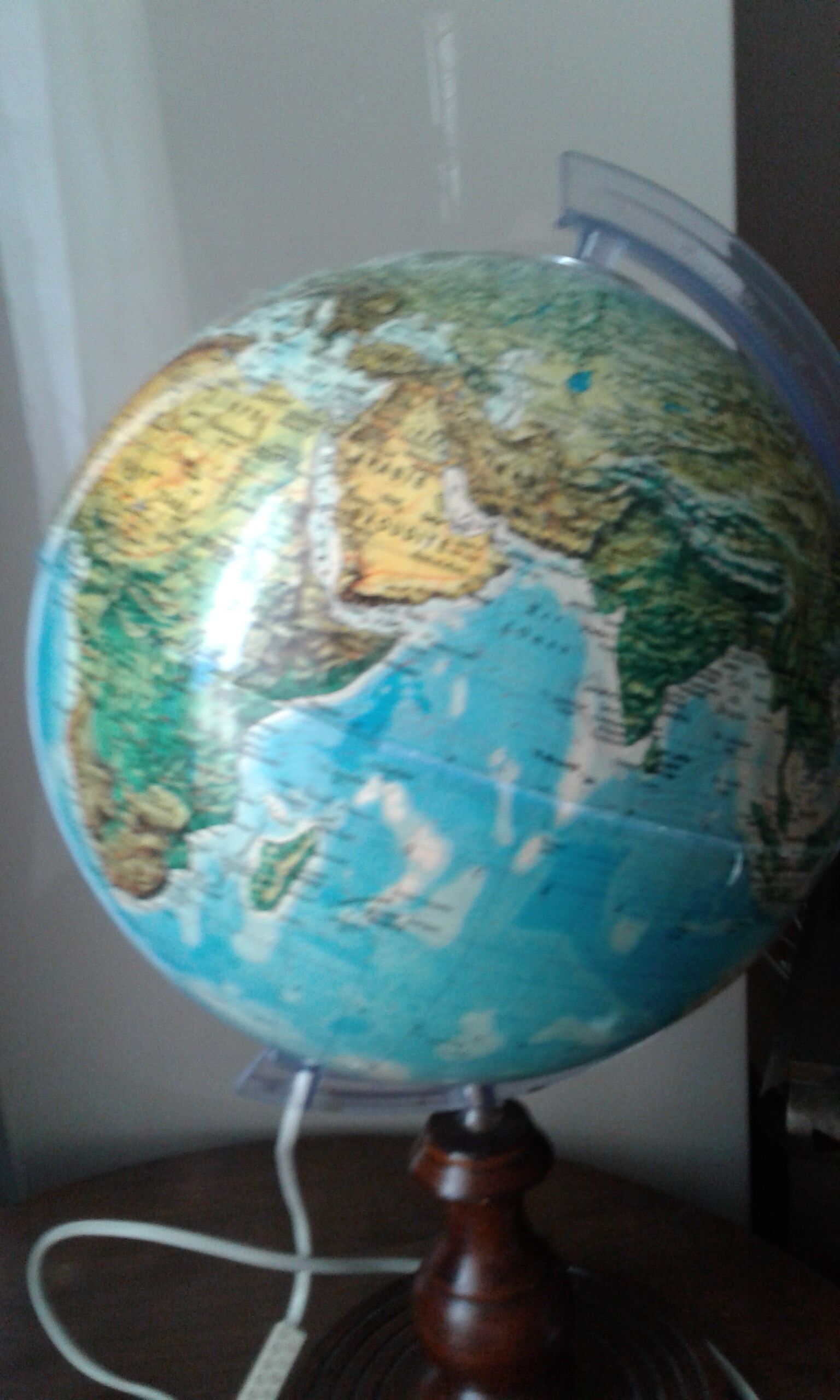 World map globe bright foot and wooden support