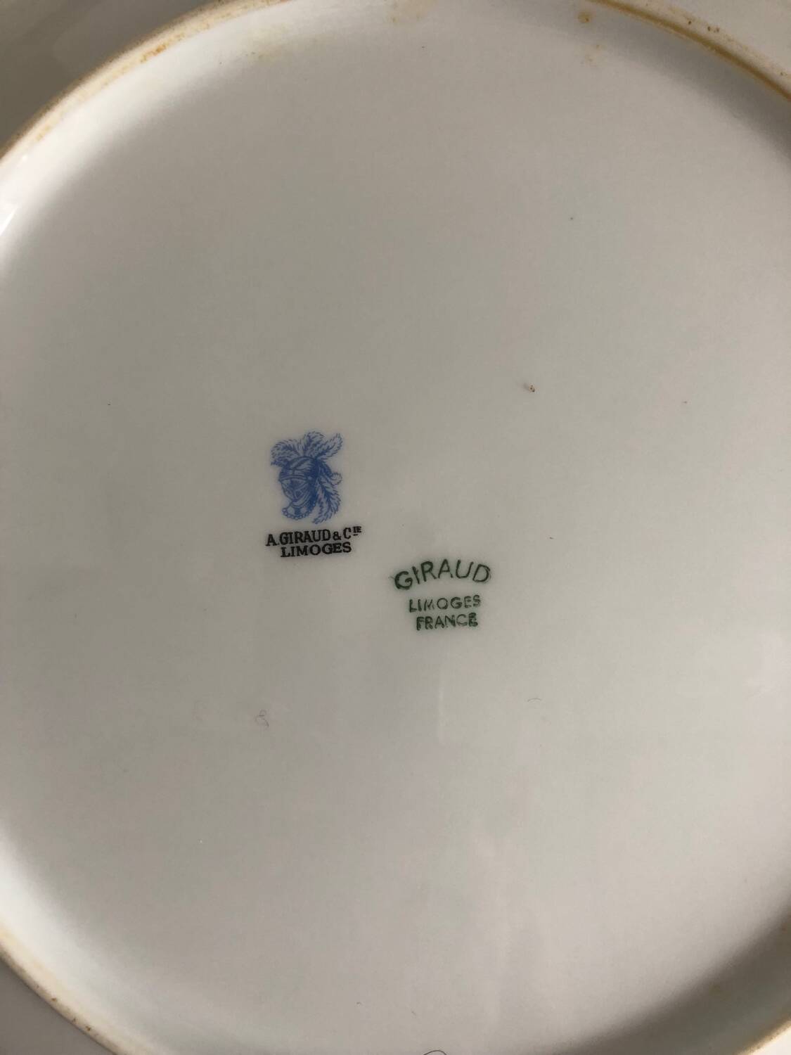 Set of 4 antique Giraud Sauviat porcelain plates.