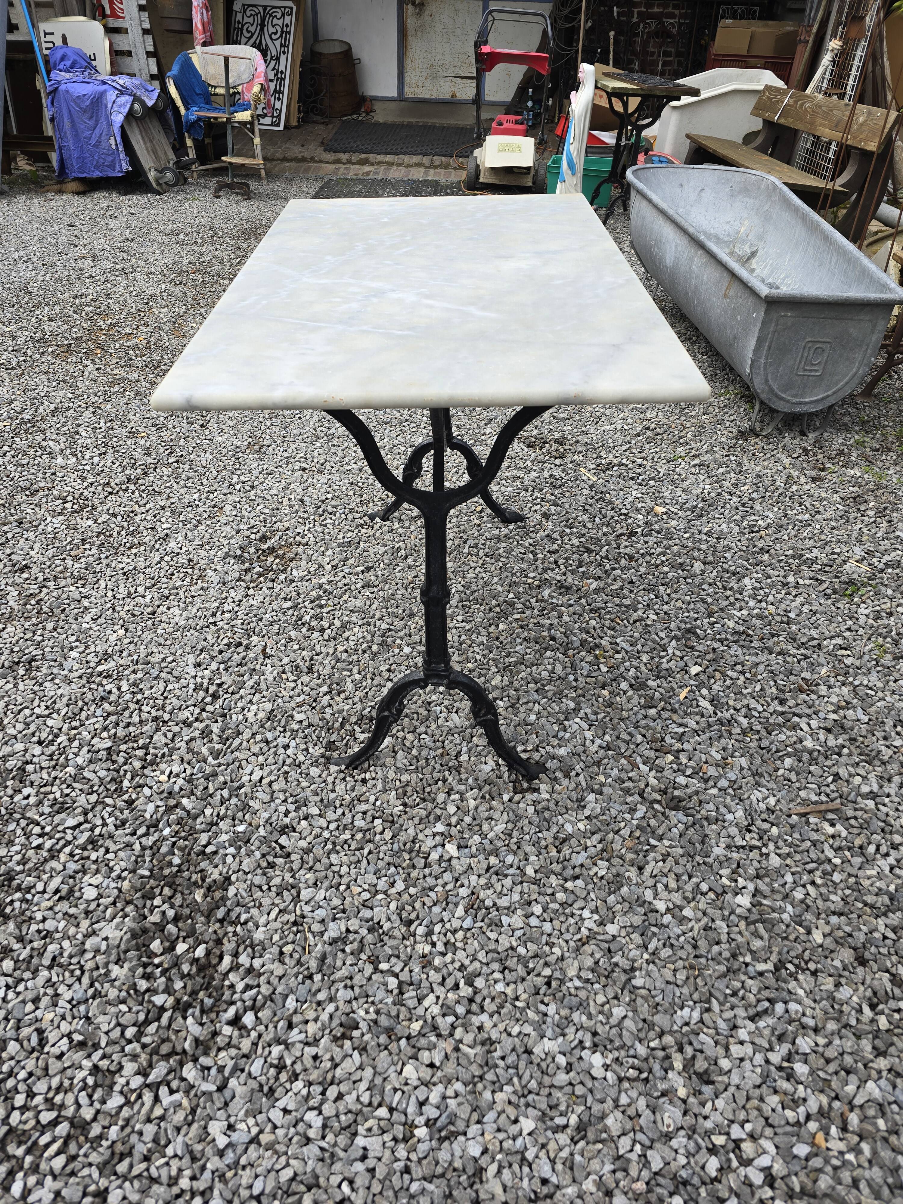 Bistro table with marble top and cast iron base