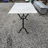 Bistro table with marble top and cast iron base
