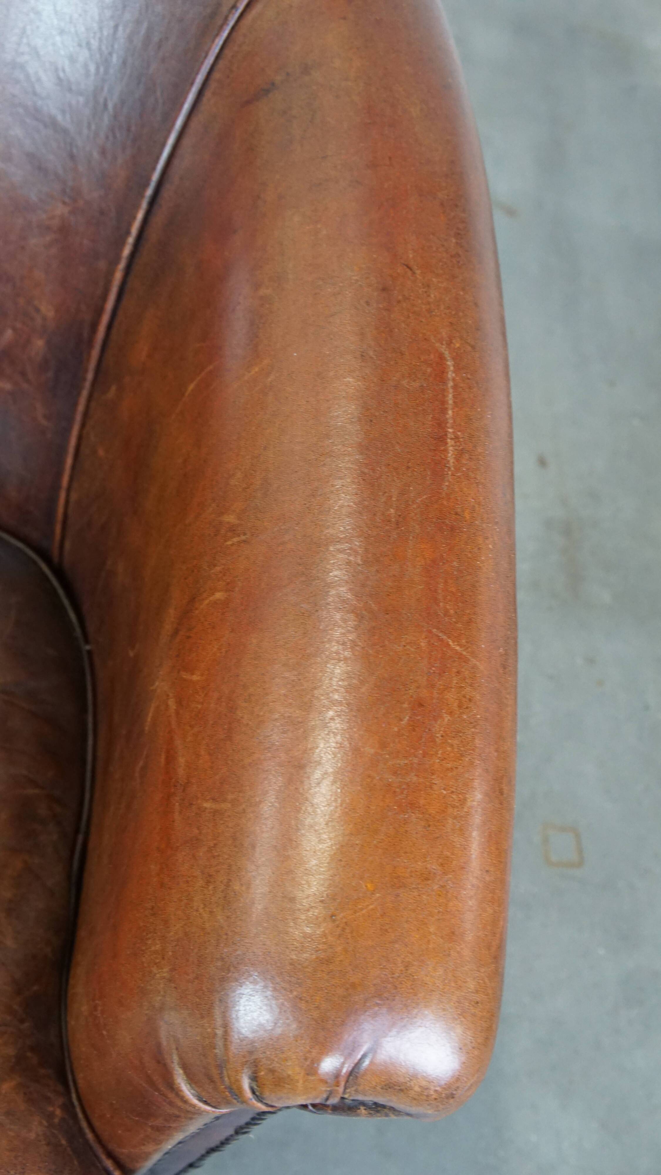 Cognac-colored sheepskin leather club chair