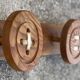 Vintage 1980 coat rack with 3 "button" hooks.