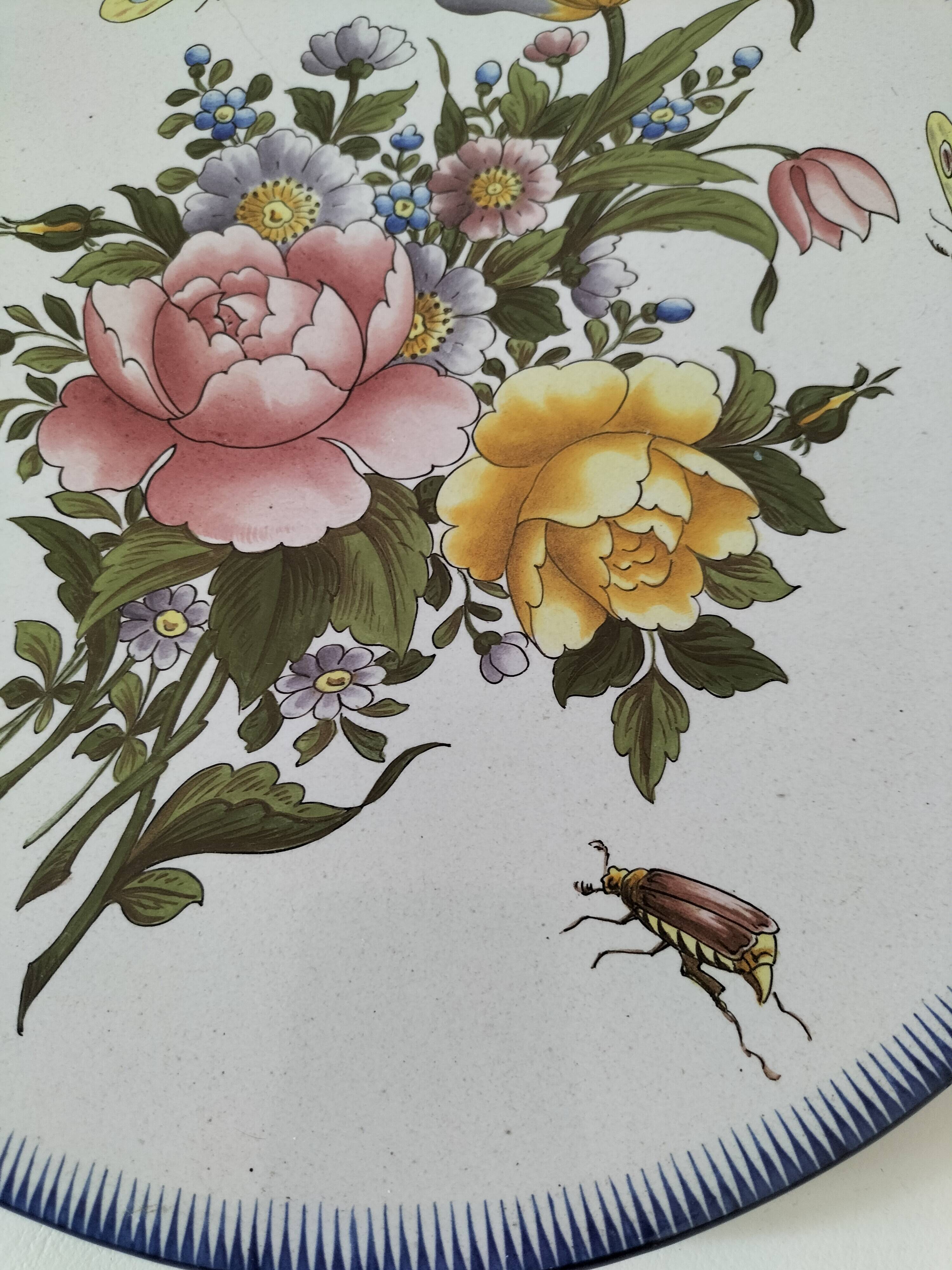 Decorative earthenware plate signed Charolles