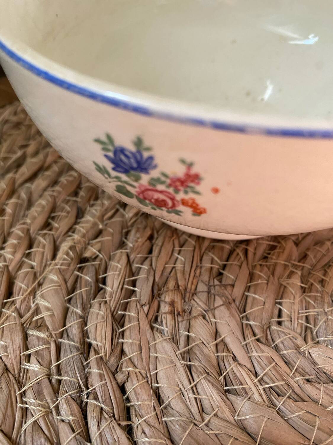Flowery bowl with blue edging.