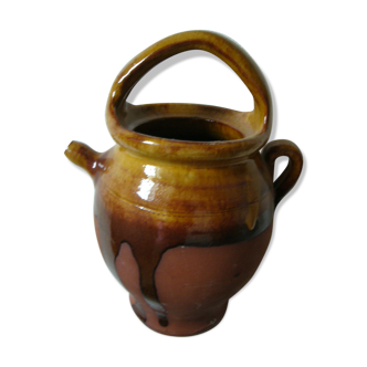 Water treating in vintage stoneware pitcher