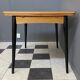 Wood enlarging dining table black wood legs 1960s