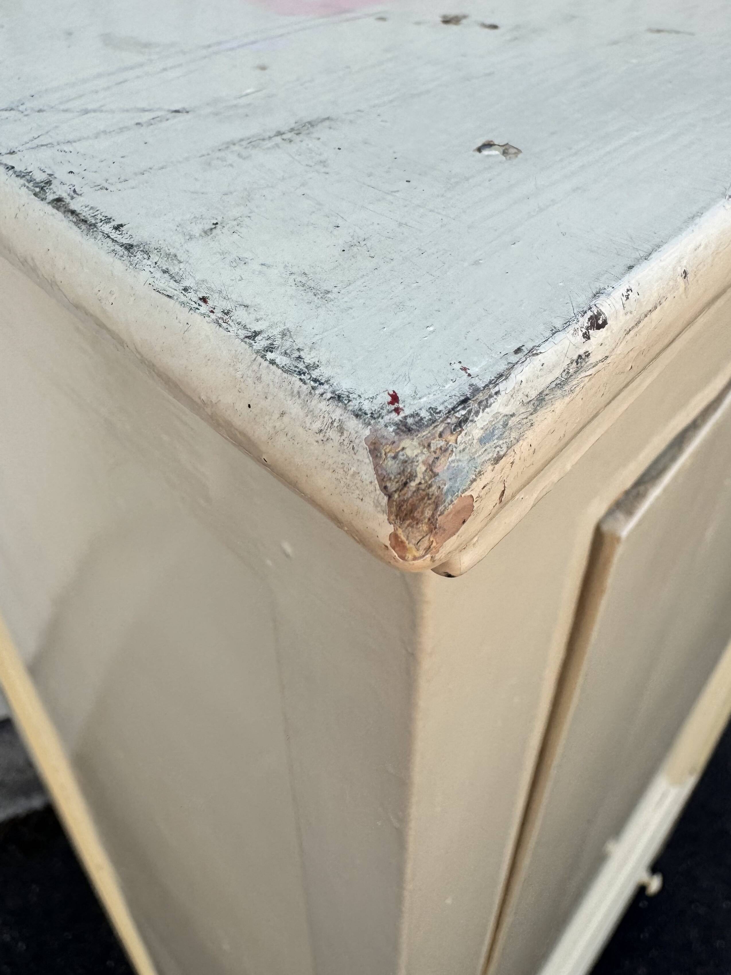 Antique painted wooden bonnet maker