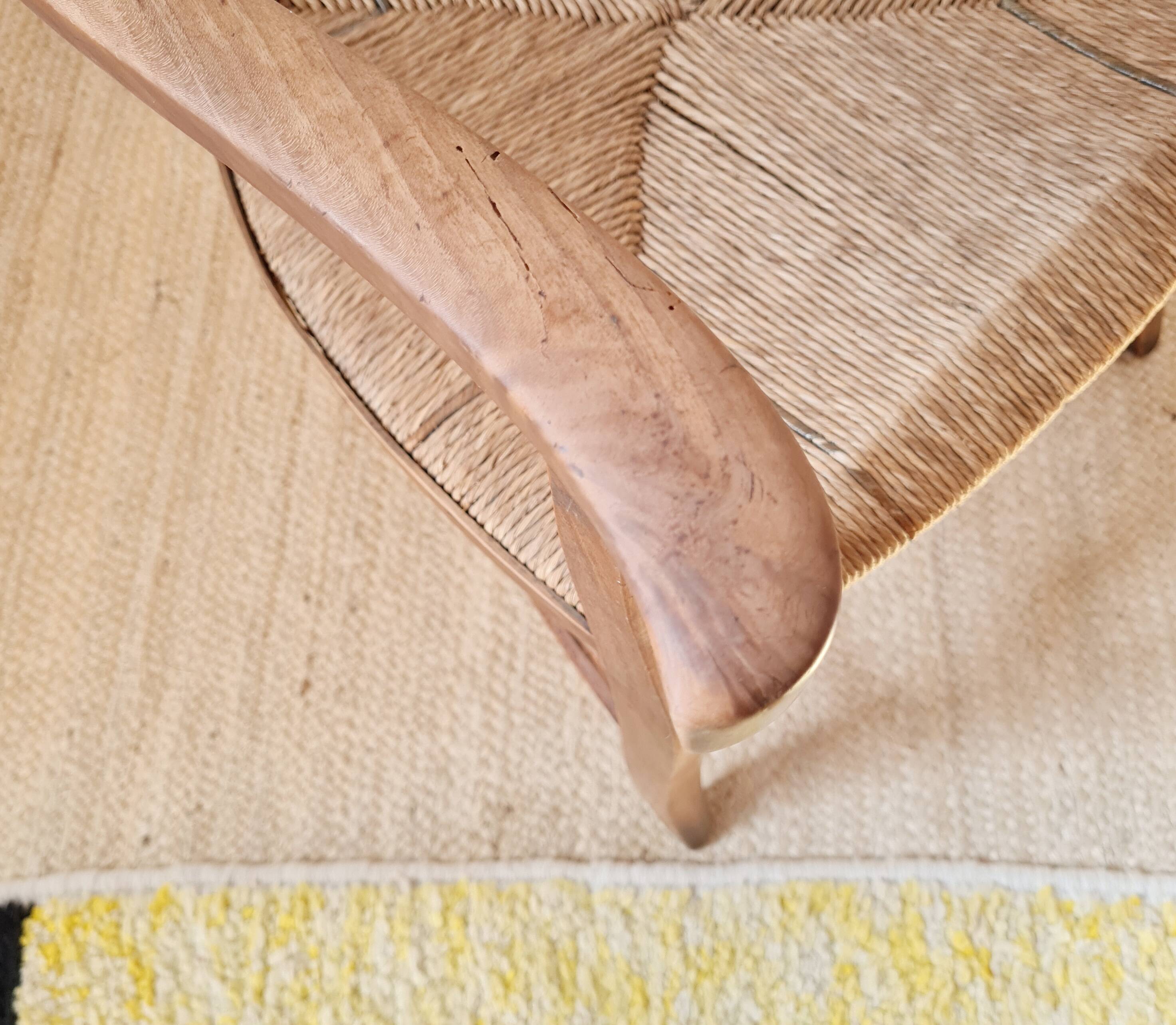 Antique campaign chair in wood and straw